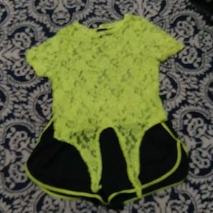 A see through neon green top and matching shorts
